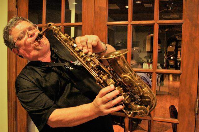 Jazz musician Dave Hall entertains drivers while they wait in the drive-thru window to pick up their orders from Giuseppe’s Ristorante from 5 to 7 p.m. Friday and Saturday nights.